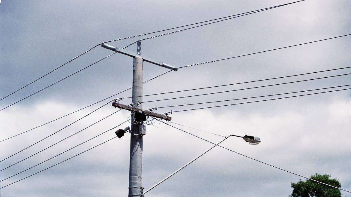 Utility pole falls on vehicle in Hopkins, sparking fire that kills driver