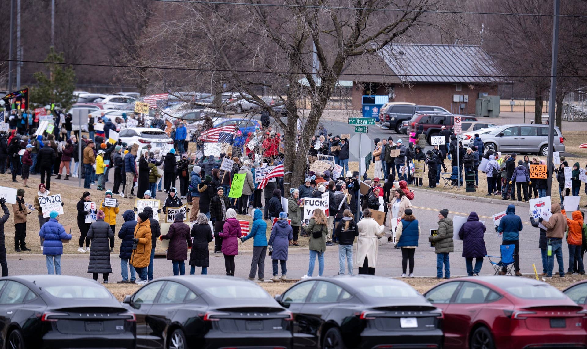 A protest against Elon Musk outside a Twin Cities Tesla showroom is ...