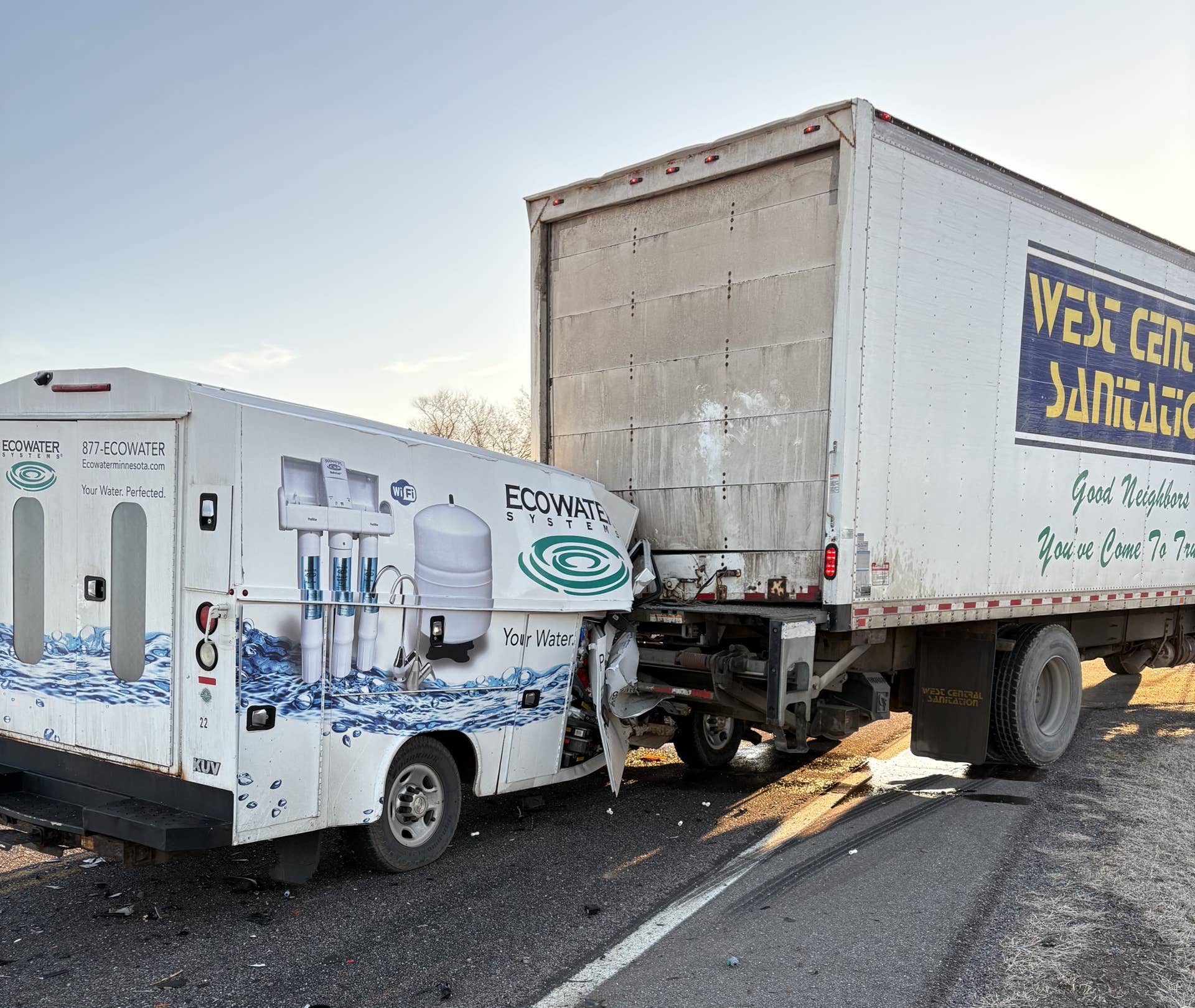Van crushed under truck in crash, driver walks away with minor injuries ...