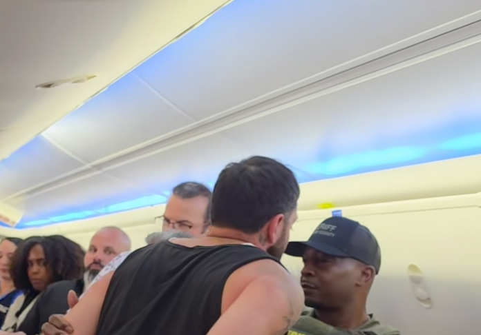 Ex-Minneapolis police chief Brian O'Hara jumps in to help restrain unruly airline passenger