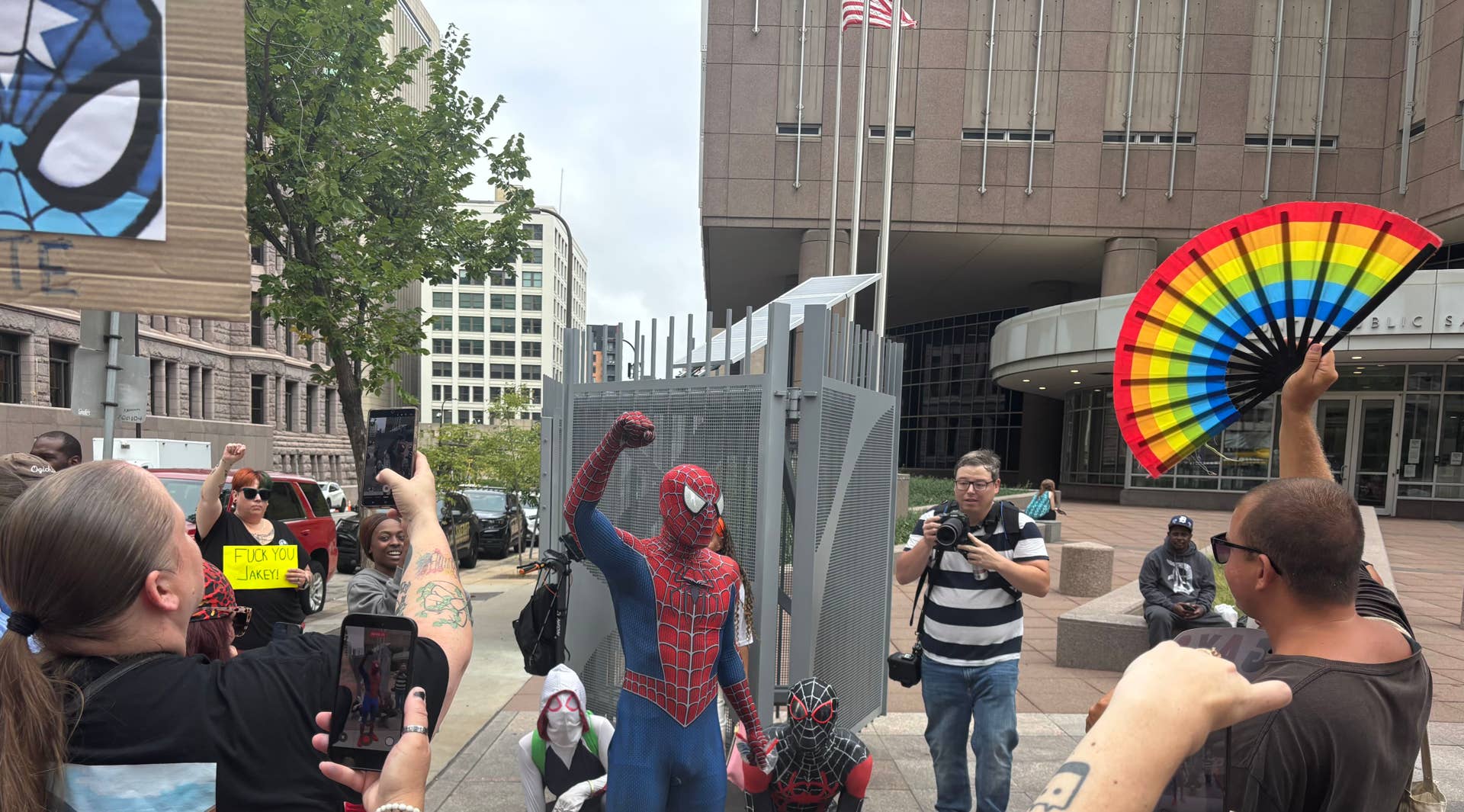 Protesters gather to support 'Spider-Man' accused of assault at Jake ...