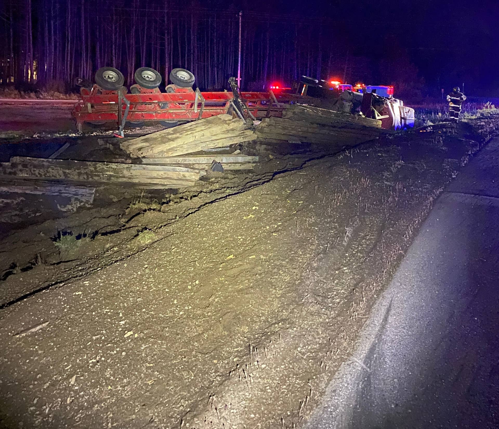 Alcohol a possible factor as semi rolls over, spilling railroad ties