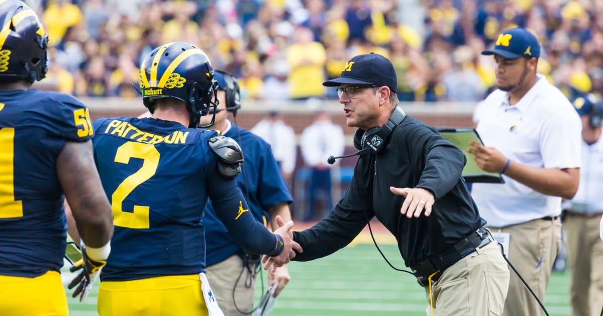 Michigan Wolverines' Jim Harbaugh interviewing with Minnesota Vikings