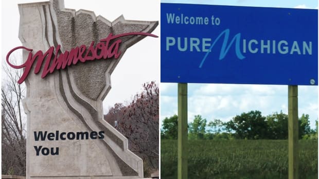 Minnesota and Michigan welcome signs