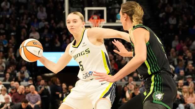 Dallas Wings guard Paige Bueckers (5) passes against Minnesota Lynx forward Alanna Smith in the second quarter at Target Center in Minneapolis on May 21, 2025.