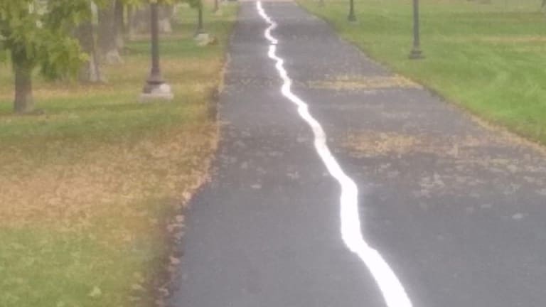Repainted Victory Memorial Park path lines in Minneapolis come out a wibbly wobbly mess