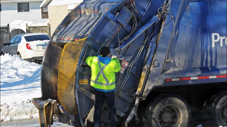 Woman rescued from inside garbage truck in Minneapolis