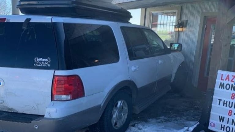 Driver hits parked car, crashes into side of small town's Lazy Bear restaurant