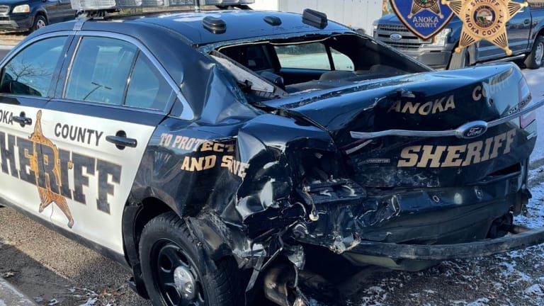 Driver slams into Anoka County squad car stopped at highway crash site