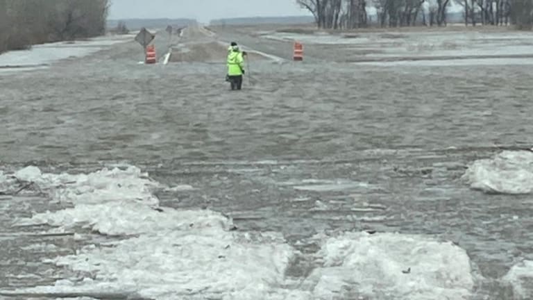 Icy floodwaters shut down parts of 2 highways near MN-ND border