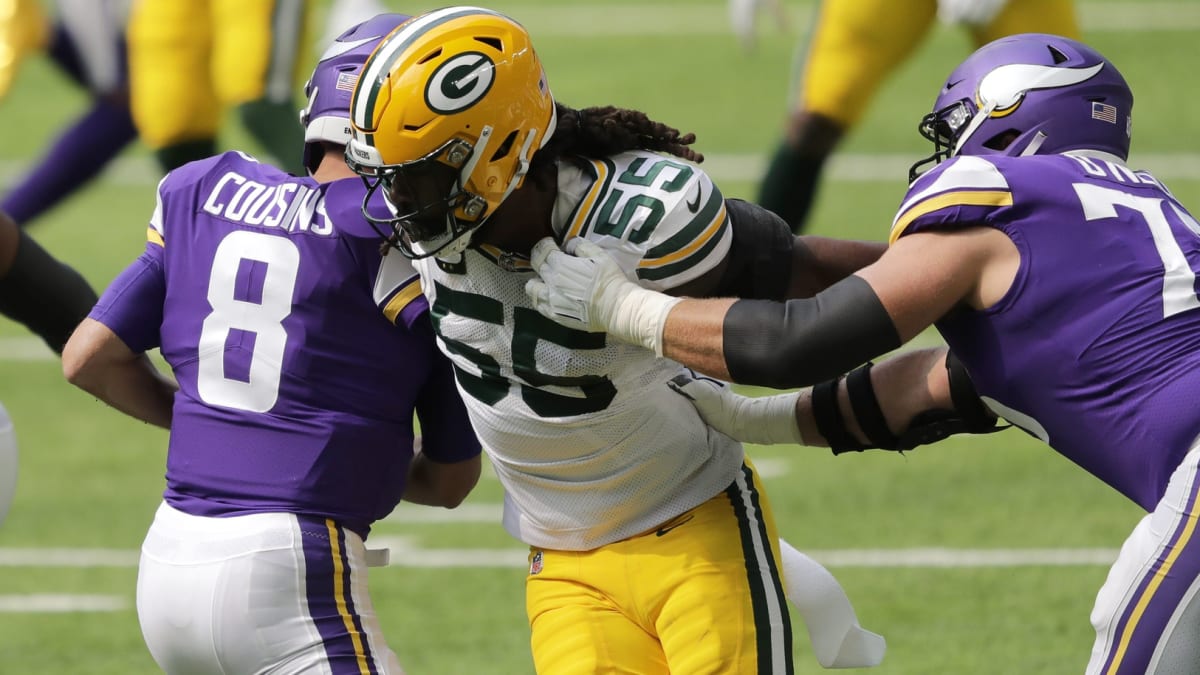 NFL Network reporter Tom Pelissero, left, interviews Minnesota Vikings  linebacker Za'Darius Smith (55) after an NFL football game against the  Green Bay Packers, Sunday, Sept. 11, 2022, in Minneapolis. The Vikings won