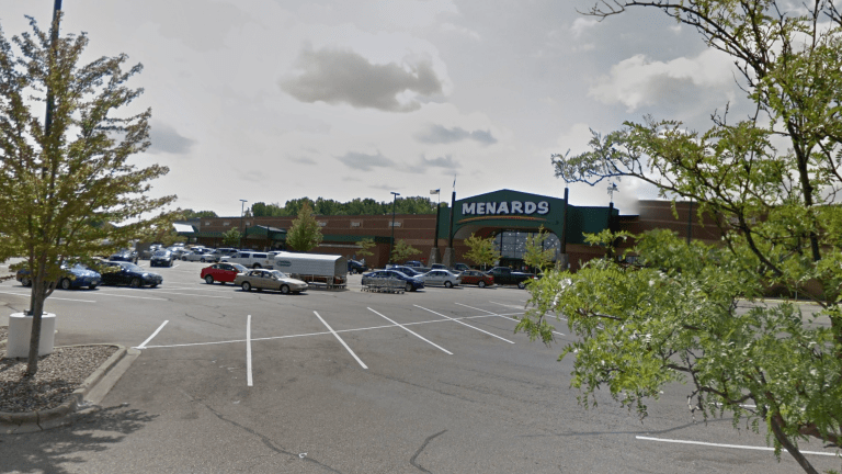 Female shot in parking lot of Twin Cities Menards store