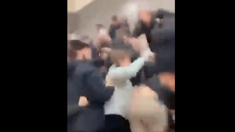 Video shows fight break out between man, students during playoff hockey