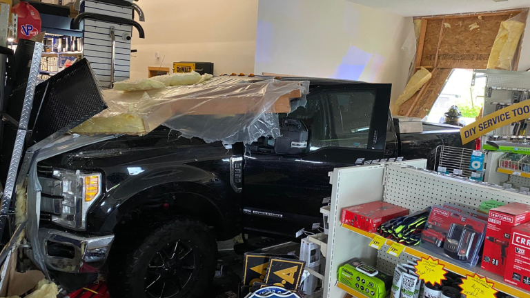 Truck crashes into Napa Auto Parts store after driver suffers medical issue