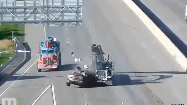 Watch: Semi-truck smashes into broken down pickup, which bursts into flames on I-35