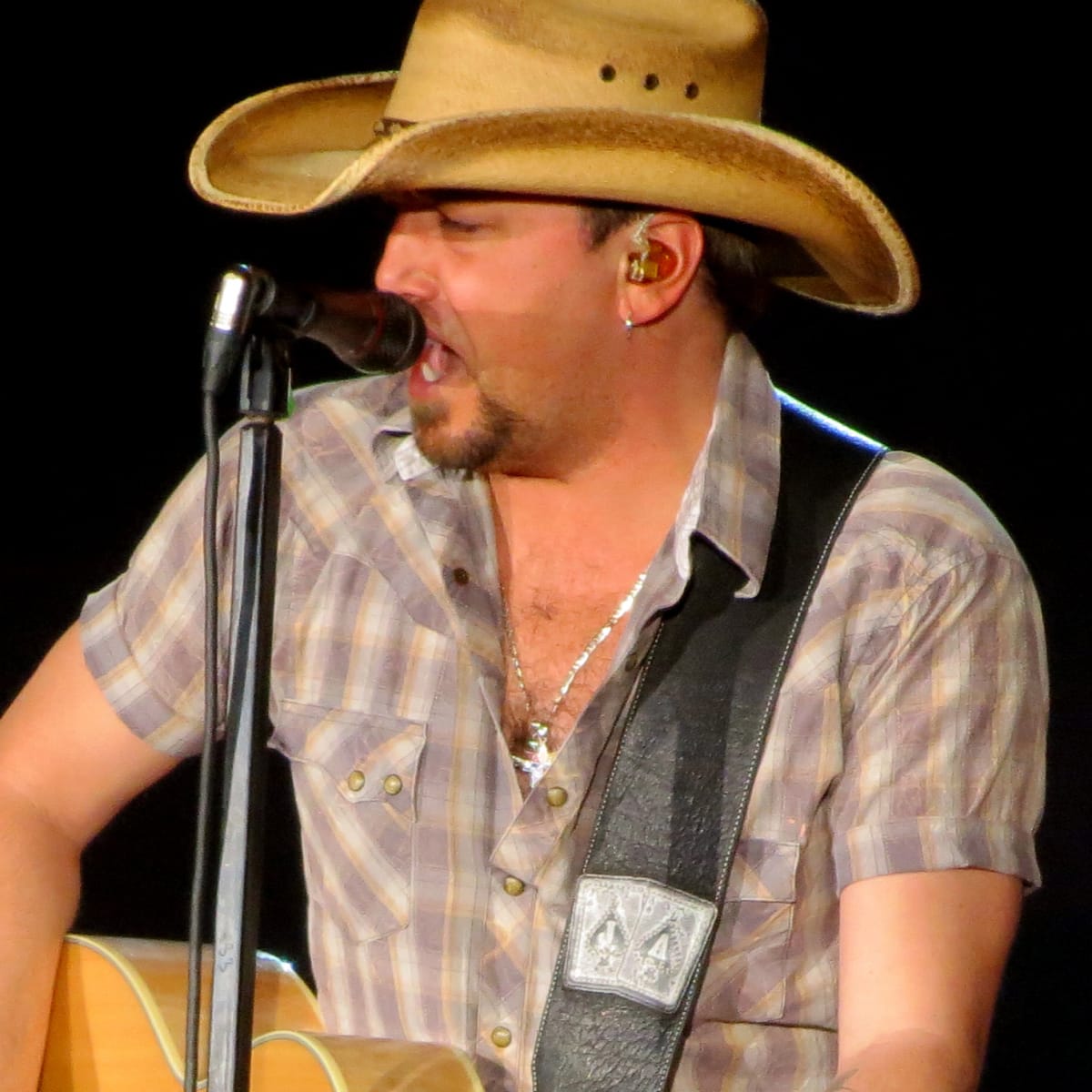 Jason Aldean performing at a 2025 concert venue