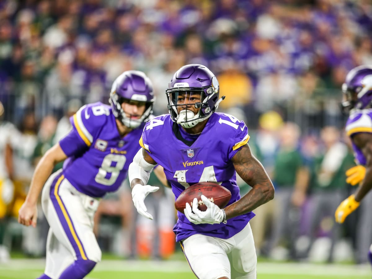 Minnesota Vikings wide receiver Stefon Diggs throws his helmet up