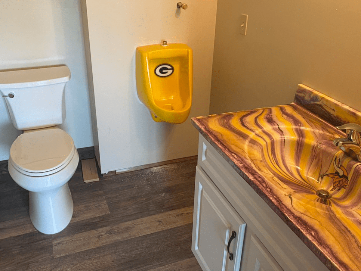 Vikings Legend Tommy Kramer has a Packers Urinal 