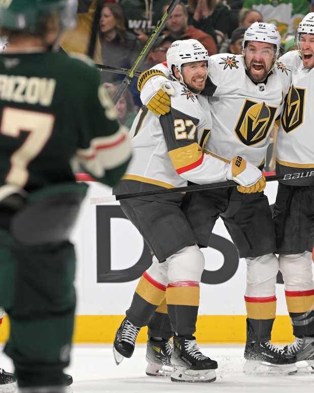 Vegas Golden Knights forward Mark Stone celebrates his goal against the Minnesota Wild with defenseman Brayden McNabb and defenseman Shea Theodore (27) during the third period in Game 6 of their first-round playoff series at Xcel Energy Center in St. Paul, Minn., on May 1, 2025.