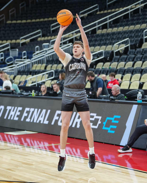 Mar 20, 2024; Pittsburgh, PA, USA; South Carolina Gamecocks guard Austin Herro (13) shoots the ball during the NCAA first round practice session at PPG Paints Arena. Mandatory Credit: Gregory Fisher-Imagn Images  