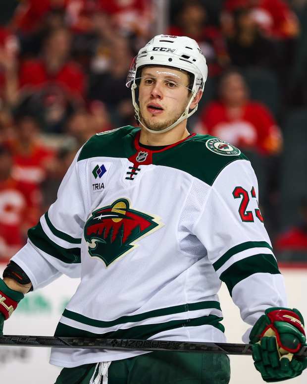 Apr 11, 2025; Calgary, Alberta, CAN; Minnesota Wild center Marco Rossi (23) against the Calgary Flames during the third period at Scotiabank Saddledome.