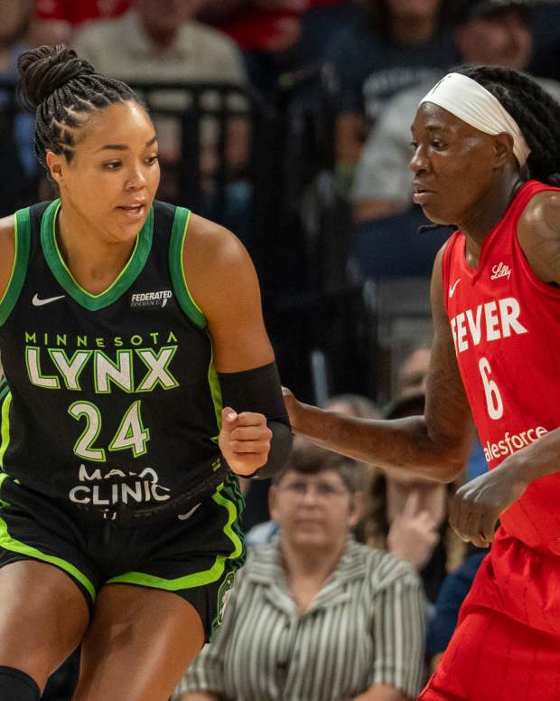 Jul 1, 2025; Minneapolis, Minnesota, USA; Minnesota Lynx forward Napheesa Collier (24) backs towards the basket against Indiana Fever forward Natasha Howard (6) in the first half during the Commissioner's Cup final at Target Center. Mandatory Credit: Jesse Johnson-Imagn Images  