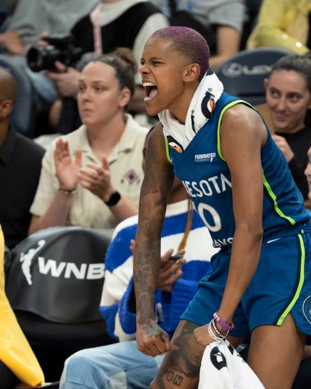 Jul 3, 2025; Minneapolis, Minnesota, USA; Minnesota Lynx guard Courtney Williams (10) celebrates from the bench after a teammate makes a shot against the Washington Mystics in the second half at Target Center. Mandatory Credit: Jesse Johnson-Imagn Images
