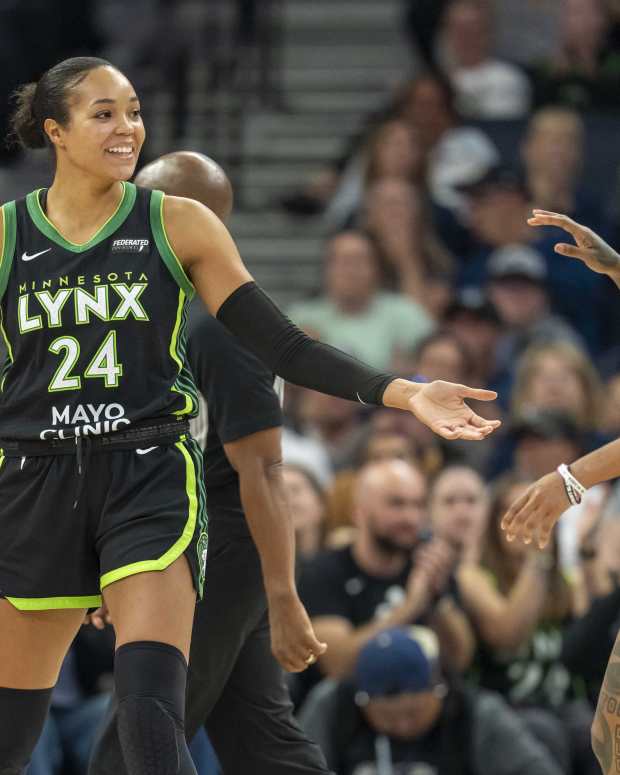 Jun 3, 2025; Minneapolis, Minnesota, USA; Minnesota Lynx forward Napheesa Collier (24) celebrates after making a shot with Minnesota Lynx guard Courtney Williams (10) against the Phoenix Mercury in the second half at Target Center.