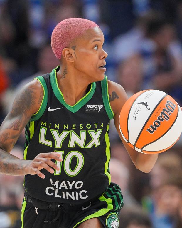 Jul 25, 2025; Minneapolis, Minnesota, USA; Minnesota Lynx guard Courtney Williams (10) dribbles against the Las Vegas Aces in the third quarter at Target Center. Mandatory Credit: Brad Rempel-Imagn Images  