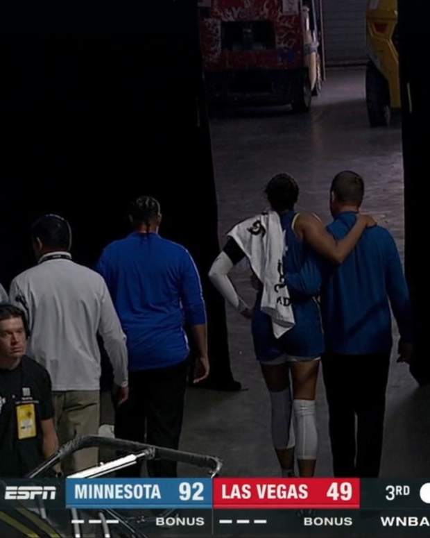 Napheesa Collier walking off the court in Saturday's game against the Aces.
