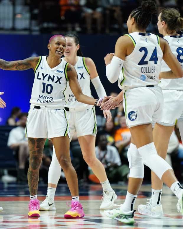 Aug 30, 2025; Uncasville, Connecticut, USA; Minnesota Lynx guard Courtney Williams (10) reacts with teammates after a play against the Connecticut Sun in the second half at Mohegan Sun Arena. Mandatory Credit: David Butler II-Imagn Images  