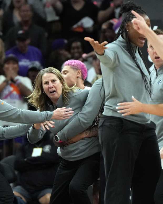 Sep 26, 2025; Phoenix, Arizona, USA; Minnesota Lynx head coach Cheryl Reeve is held back after being ejected during game three against the Phoenix Mercury of the second round for the 2025 WNBA Playoffs at PHX Arena.