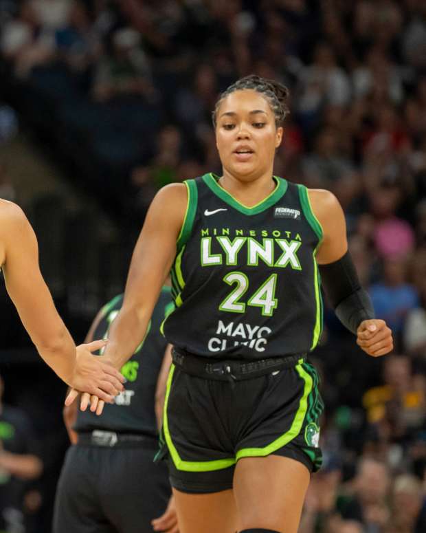 Alanna Smith (8) shakes hands with Minnesota Lynx forward Napheesa Collier (24) after making a shot