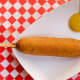 Plant-based vegan hot dog hand-dipped in plant-based vegan corn dog batter and deep-fried.At Daryl’s Dog House, located on the south side of Carnes Avenue between Nelson and Underwood streets