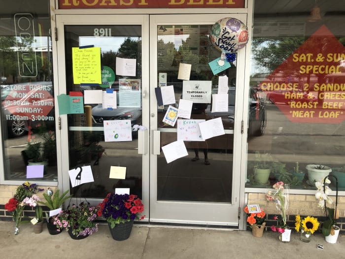 Bloomington residents left flowers and notes of encouragement for Kevan Tran after the shooting.