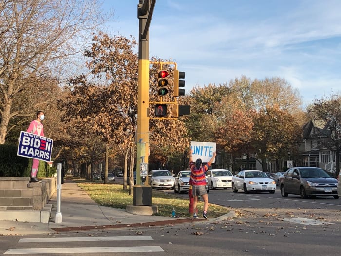 Brooke Steigauf and Ethan Hanson stood at the intersection celebrating Biden's win for hours Saturday afternoon.