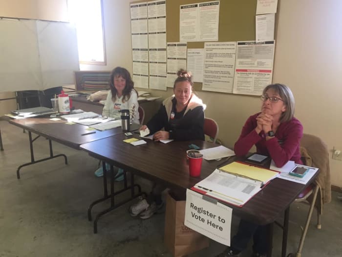 Wiscoy Township Treasurer, Dawn Kronebusch, far left, and Wiscoy Township Clerk, Cassi Waldo, far right, are pictured here after voter Kaitlyn O'Connor says she asked them to wear masks because of the coronavirus pandemic.