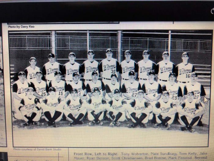 The 2001 UST National Championship team. Kelly is pictured third from left in the front row.