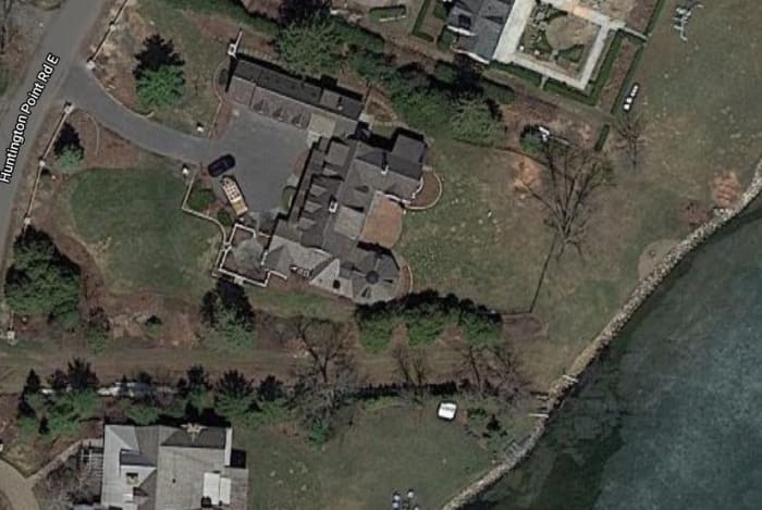 The Schusslers' home, and to the south, the city-owned lane at the end of which a dock is place in the summer.