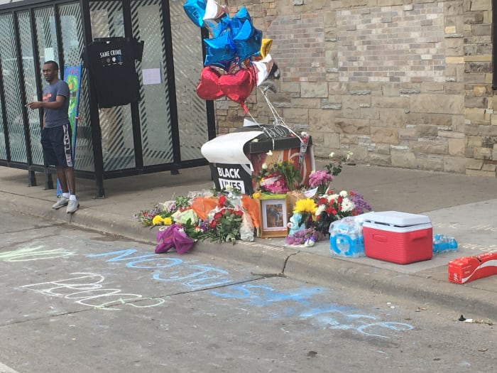 Remembrances left at the site where George Floyd died after a Minneapolis police officer knelt on his neck.