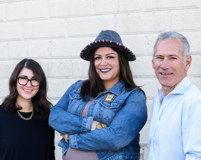 Minnetonka Moccasin President Jori Miller Sherer, Reconciliation Advisor Adrienne Benjamin and CEO David Miller.