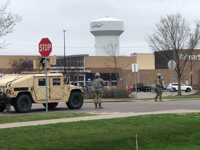 National Guard soldiers patrol the area that was affected by civil unrest on Sunday, April 11.
