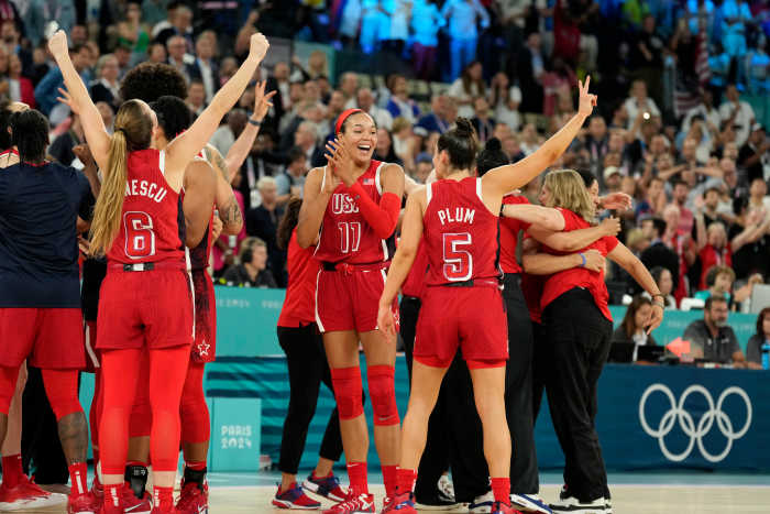United States forward Napheesa Collier (11) and guard Kelsey Plum (5) celebrate after defeating France in the women's gold-medal game during the Paris Olympics at Accor Arena in Paris on Aug. 11, 2024.