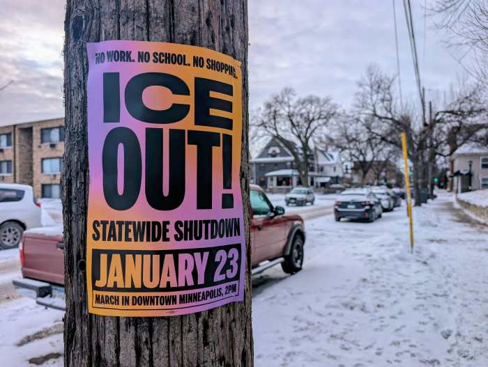 A poster for the Jan. 23 protest on a light pole in Minneapolis.