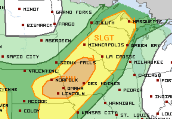 Areas shaded in yellow have a slight risk for severe storms, while the orange-shaded area has an enhanced risk.