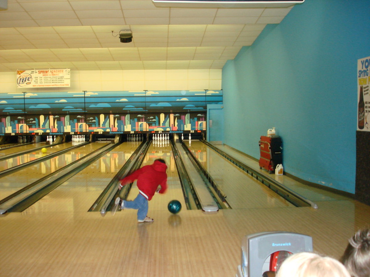 A child in a bowling alley.