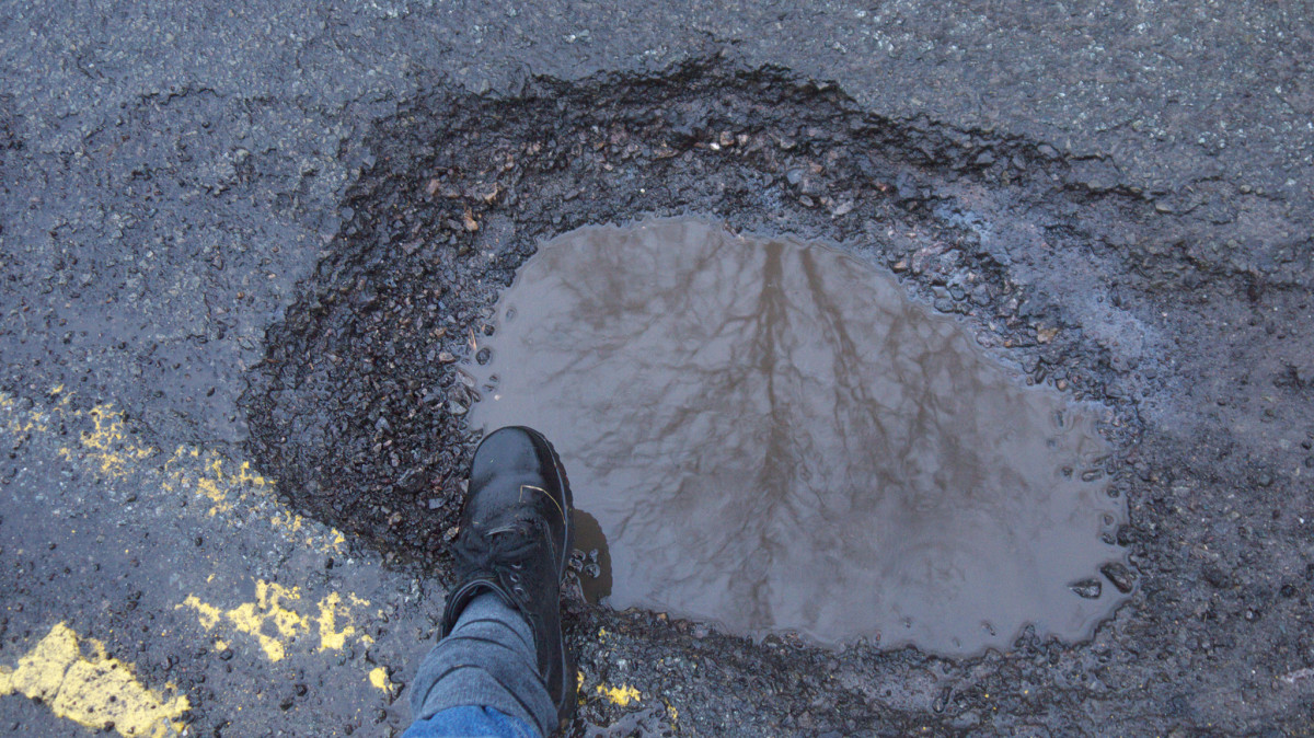 flickr-pothole-foot-boot-road-street