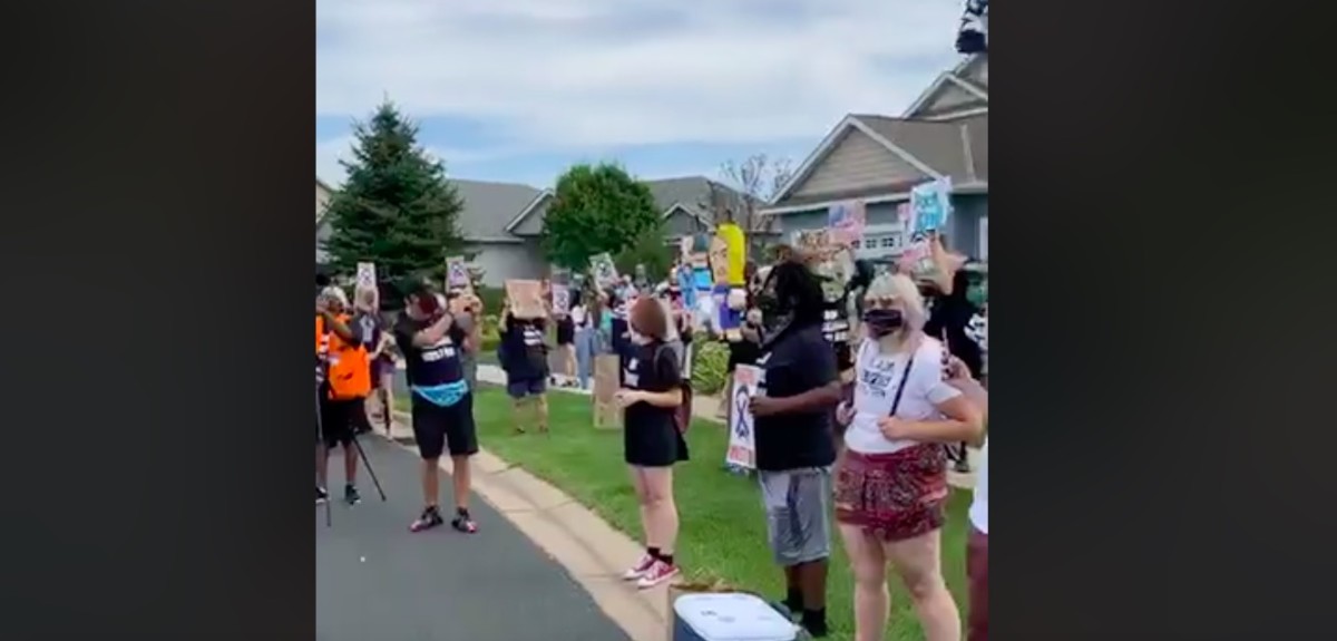 The Liz Collin piñata can be seen in the background of Nekima Levy-Armstrong's live video.