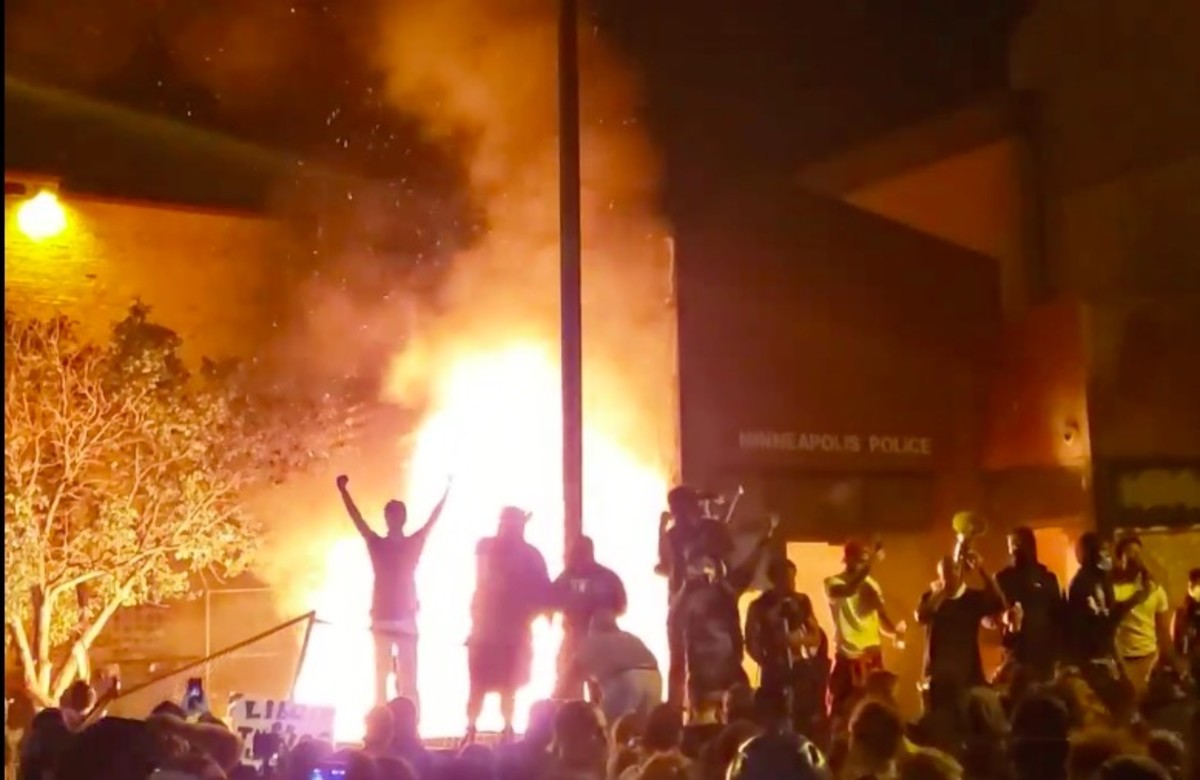 Protesters outside the burning 3rd Precinct in Minneapolis. 