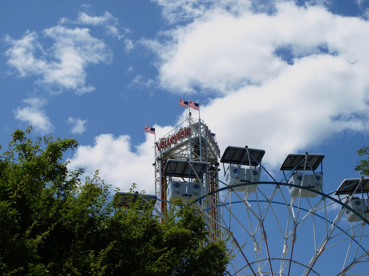 The top of the Ferris wheel and Power Tower rides at Valleyfair amusement park.